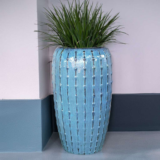 Wholesale Tall ribbed ceramic planter in light blue with a textured surface