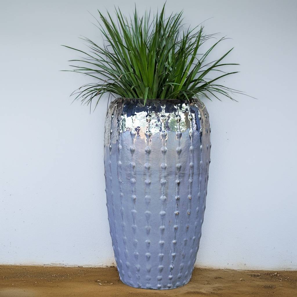 Tall ribbed ceramic planter with a glossy gray finish
