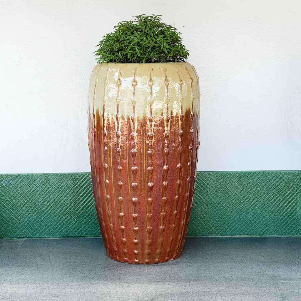 Tall ribbed ceramic planter with a glossy brown and beige finish