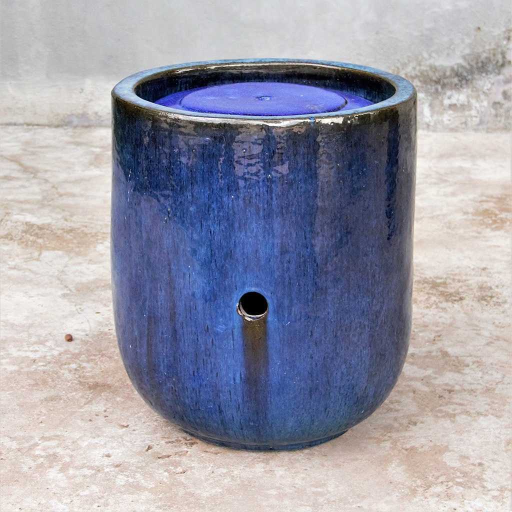 Tall rounded cylinder planters in a deep blue-black finish