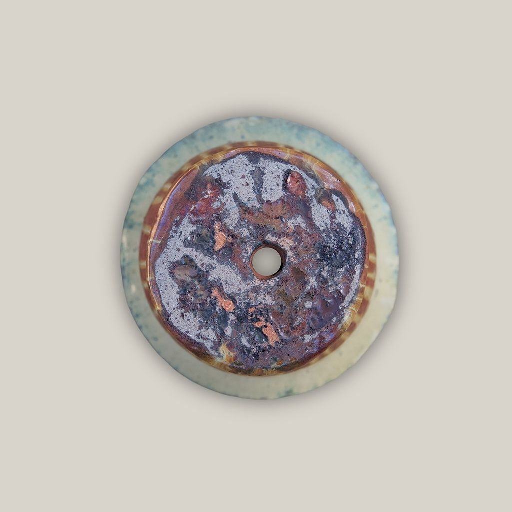 multicolored design featuring a metallic copper bottom and blue-grey edges