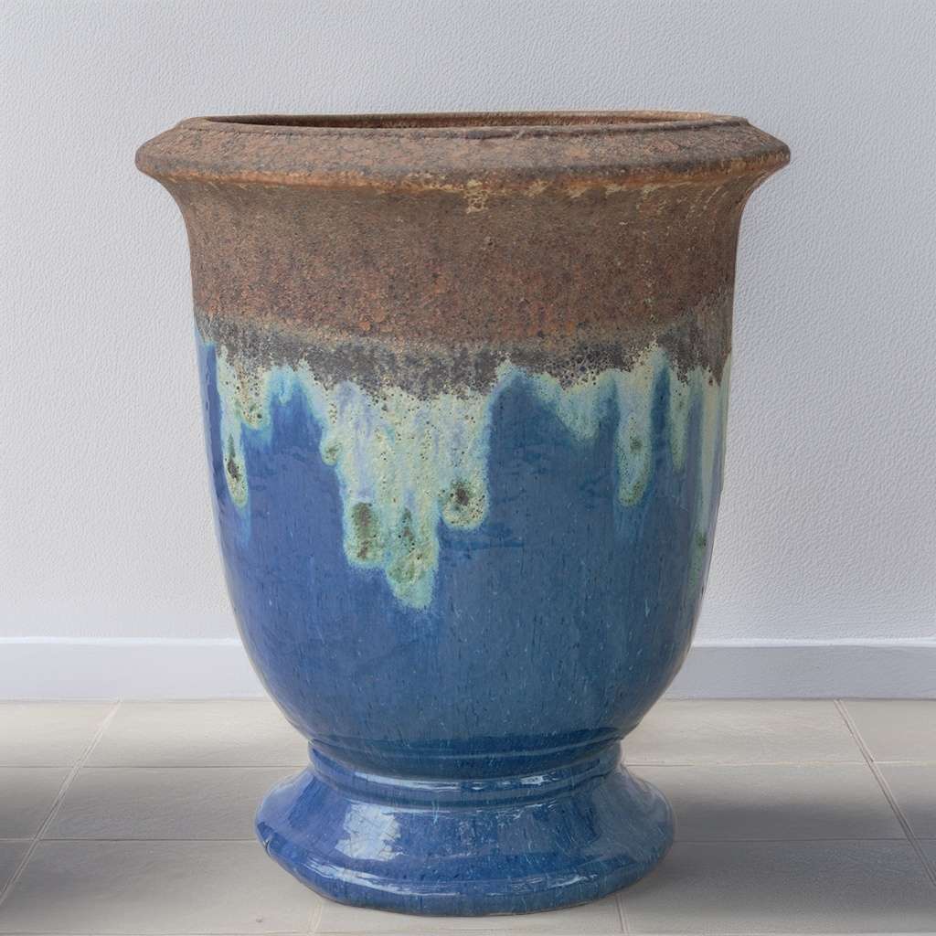 Wholesale Two-tone pedestal ceramic planter featuring a glossy blue body with a textured, unglazed brown rim