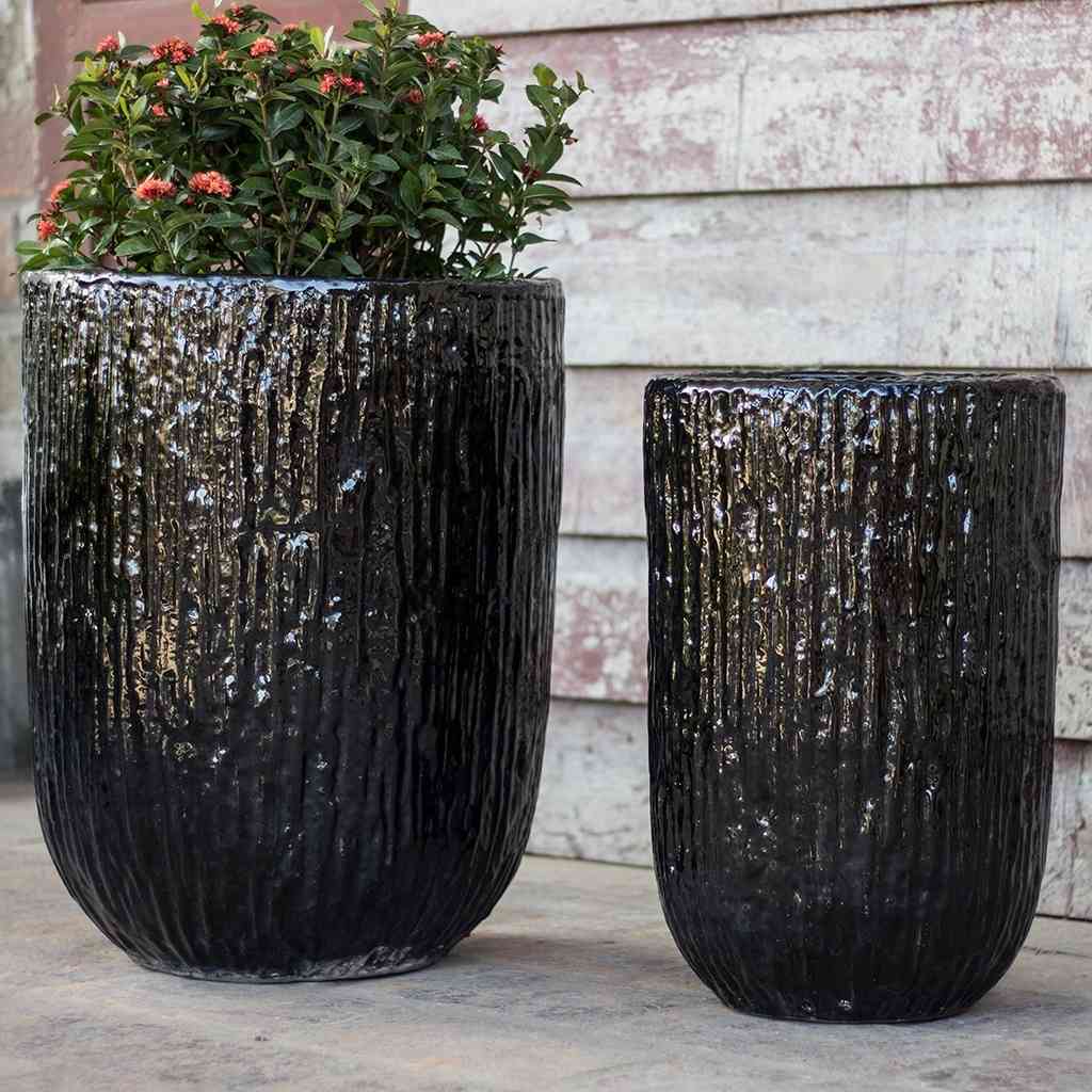 Wholesale Tall cylindrical planters with a glossy black ripple glaze texture
