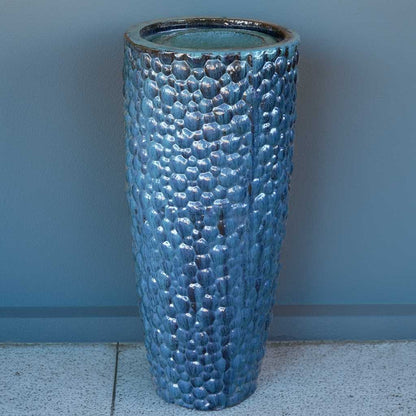 Wholesale Tall ceramic planter with a pebbled texture and a glossy blue glaze