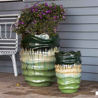 Multi-toned wave rim ceramic planter featuring shades of green and cream