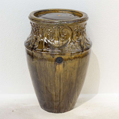 Vase-style ceramic planter with a glossy golden brown finish