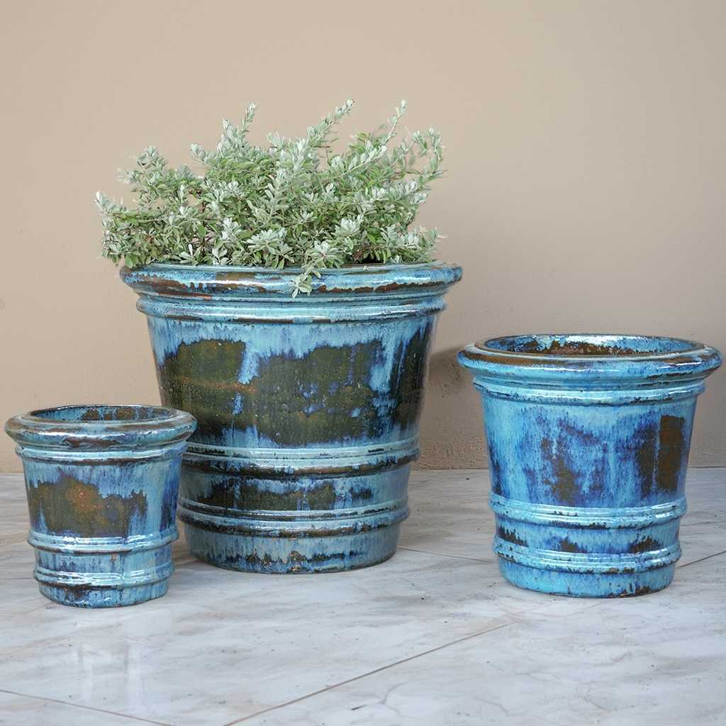 Ceramic planters with a distressed blue and green glazed finish and a frosted rim