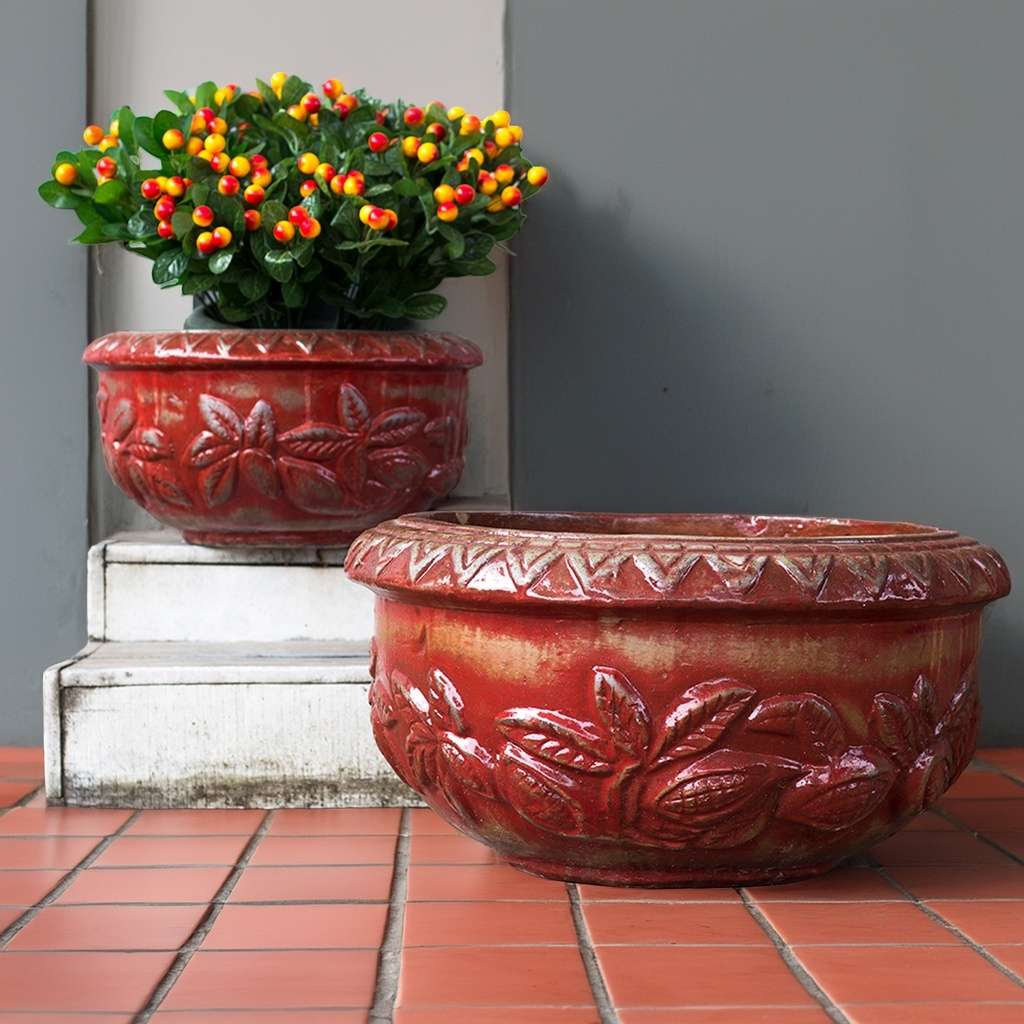 Reddish-brown distressed bowl planter with embossed Tuscany leaf pattern