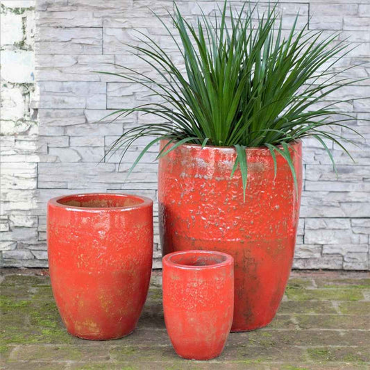 Wholesale Tall ceramic planters in antique orange with a Tuscany-inspired textured finish