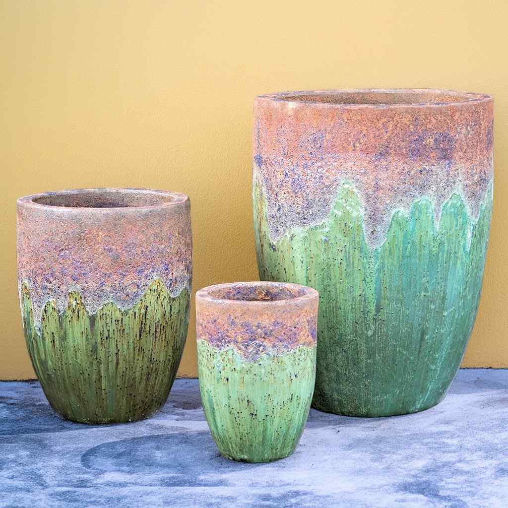 Tall rounded ceramic planters in antique green with a textured top