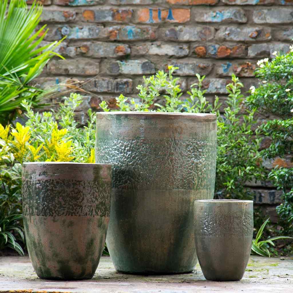 Tall rounded ceramic planters with a Tuscany-inspired brown and green finish
