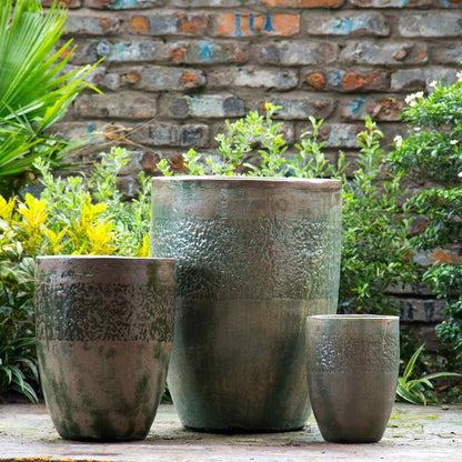 Tall rounded ceramic planters with a Tuscany-inspired brown and green finish