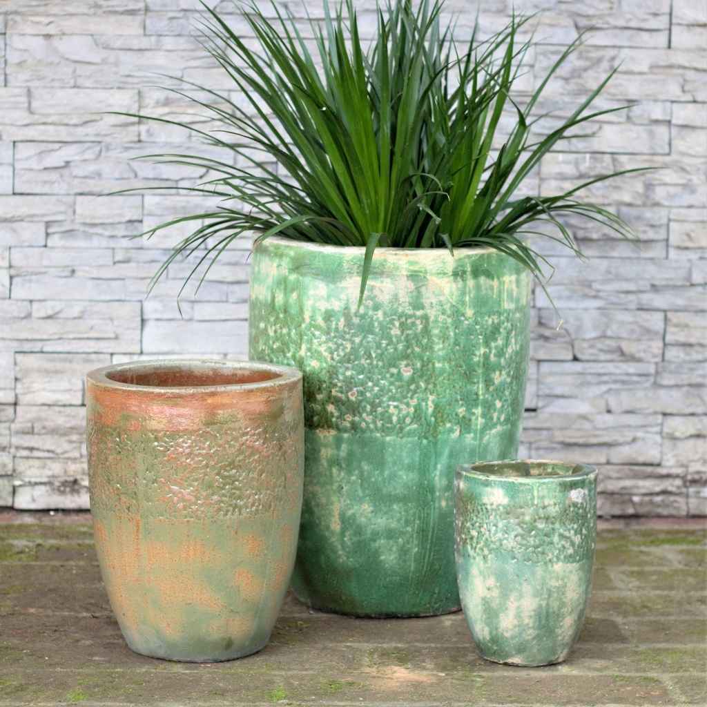 Tall rounded ceramic planter with Tuscany textured finish in distressed green and earthy tones