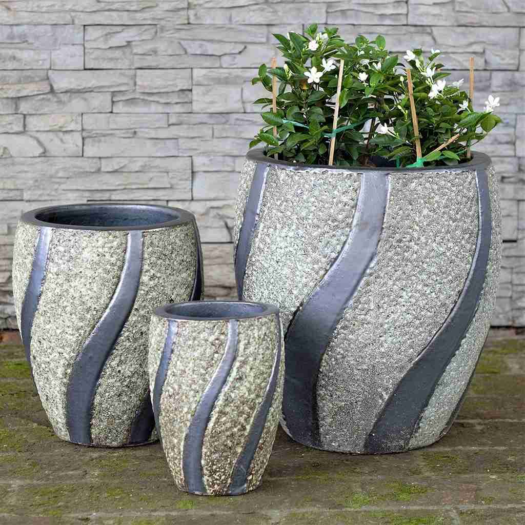 Wholesale Modern oval ceramic pot with a textured white stone finish and gray swirling accents
