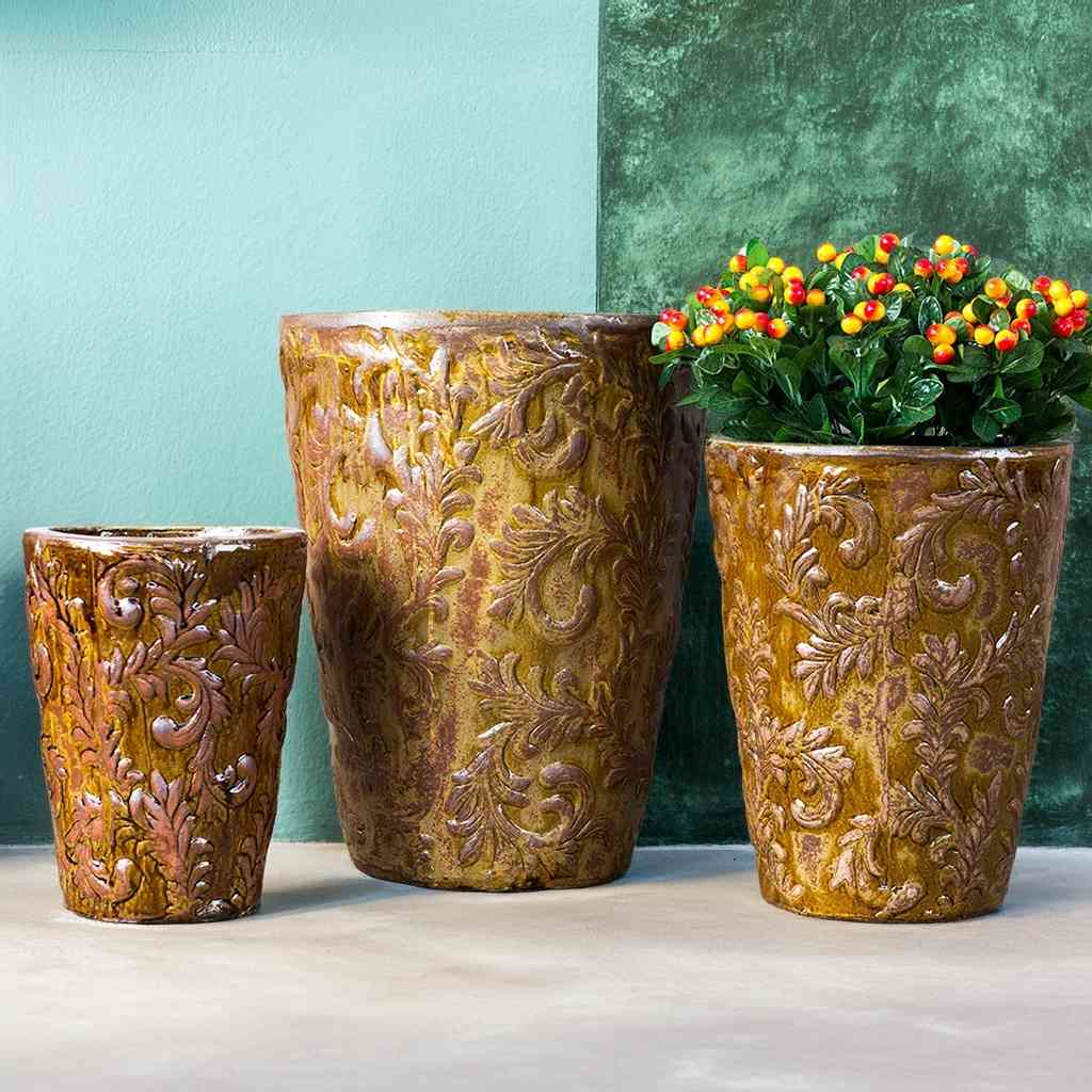Elegant gold tall tapered planter featuring an embossed foliage pattern