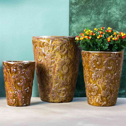 Elegant gold tall tapered planter featuring an embossed foliage pattern