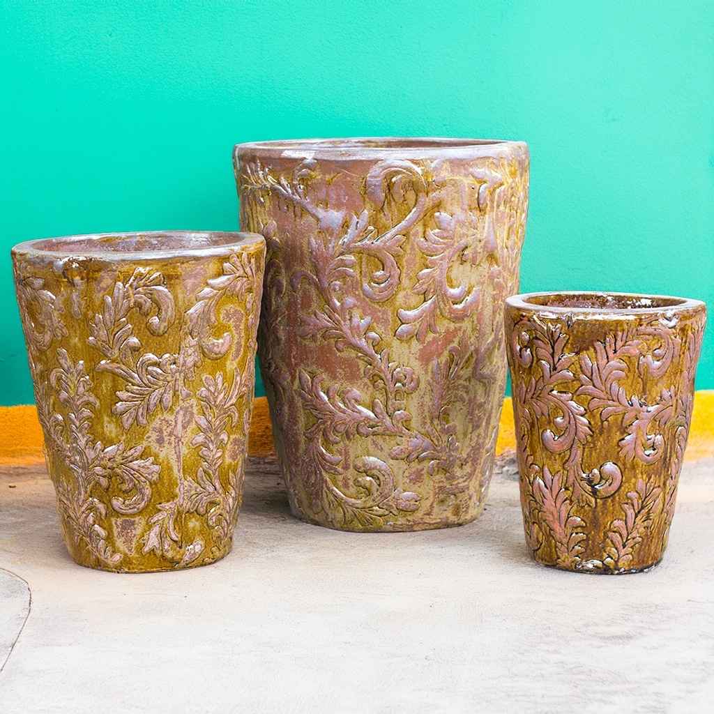 Elegant gold tall tapered planter featuring an embossed foliage pattern