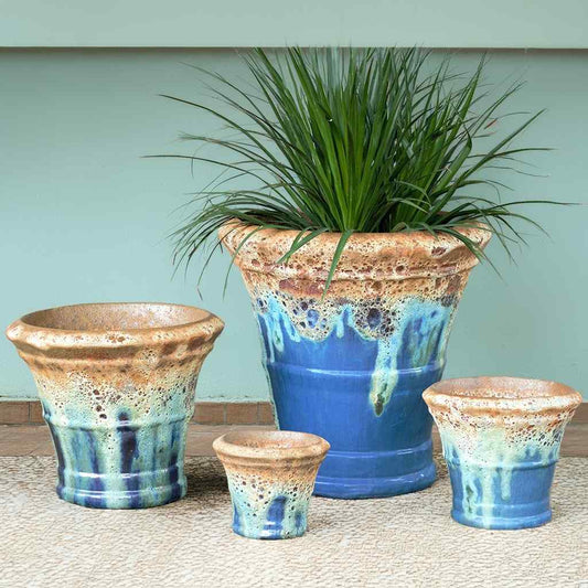Wholesale set of Flare rim planters glazed in blue with a light blue drip effect and an unglazed sandy-brown rim
