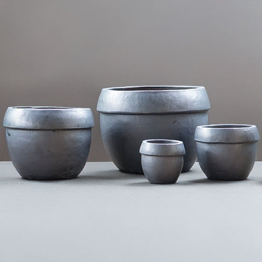 Wholesale Wide-rim rounded ceramic planter in matte black with a smooth, modern finish