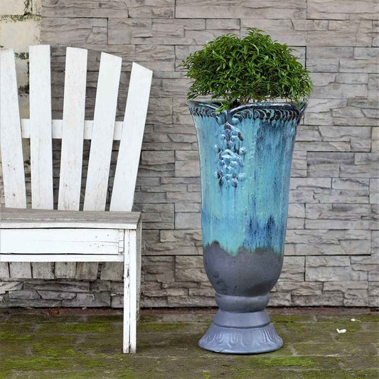 Wholesale Two-tone pedestal vase planter in turquoise and dark gray, featuring an embossed flower design
