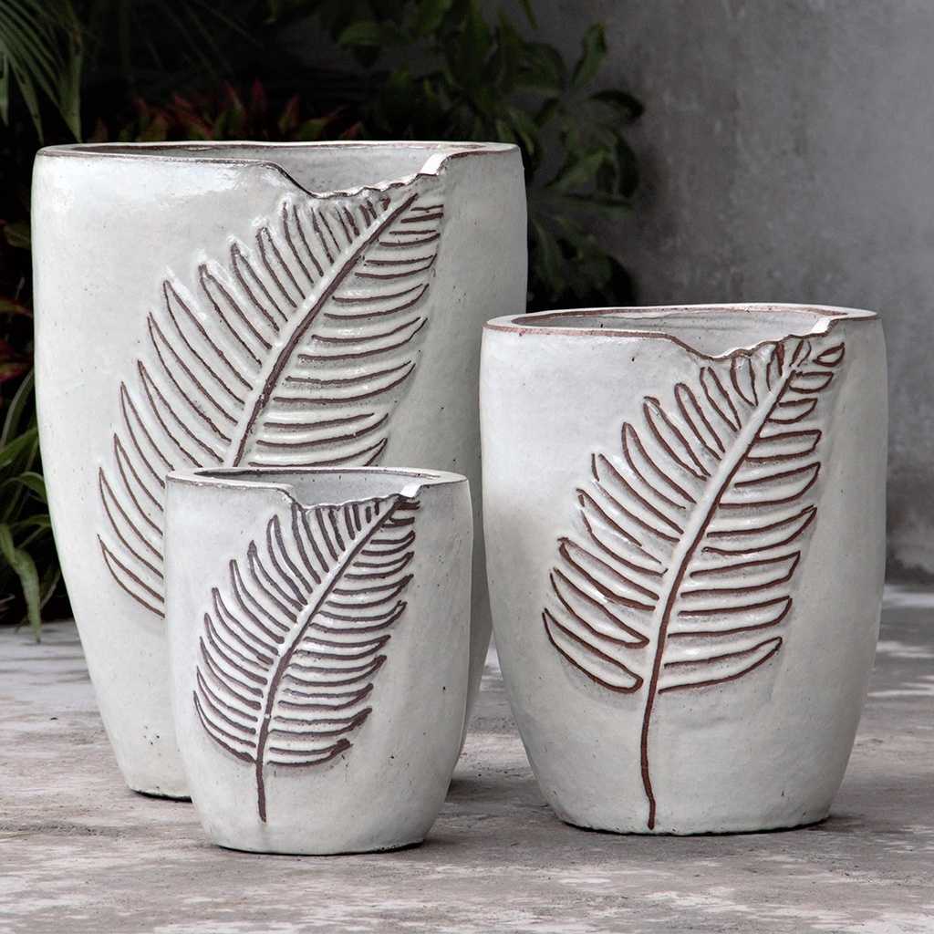 Oval ceramic planter in white with a delicate leaf-embossed texture for an elegant, nature-inspired design
