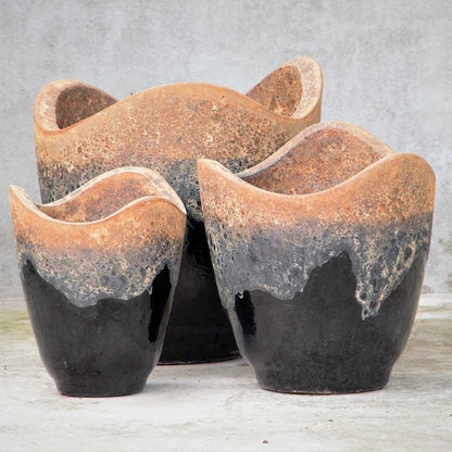Wave-top ceramic planter in glossy black with a rustic, textured rim
