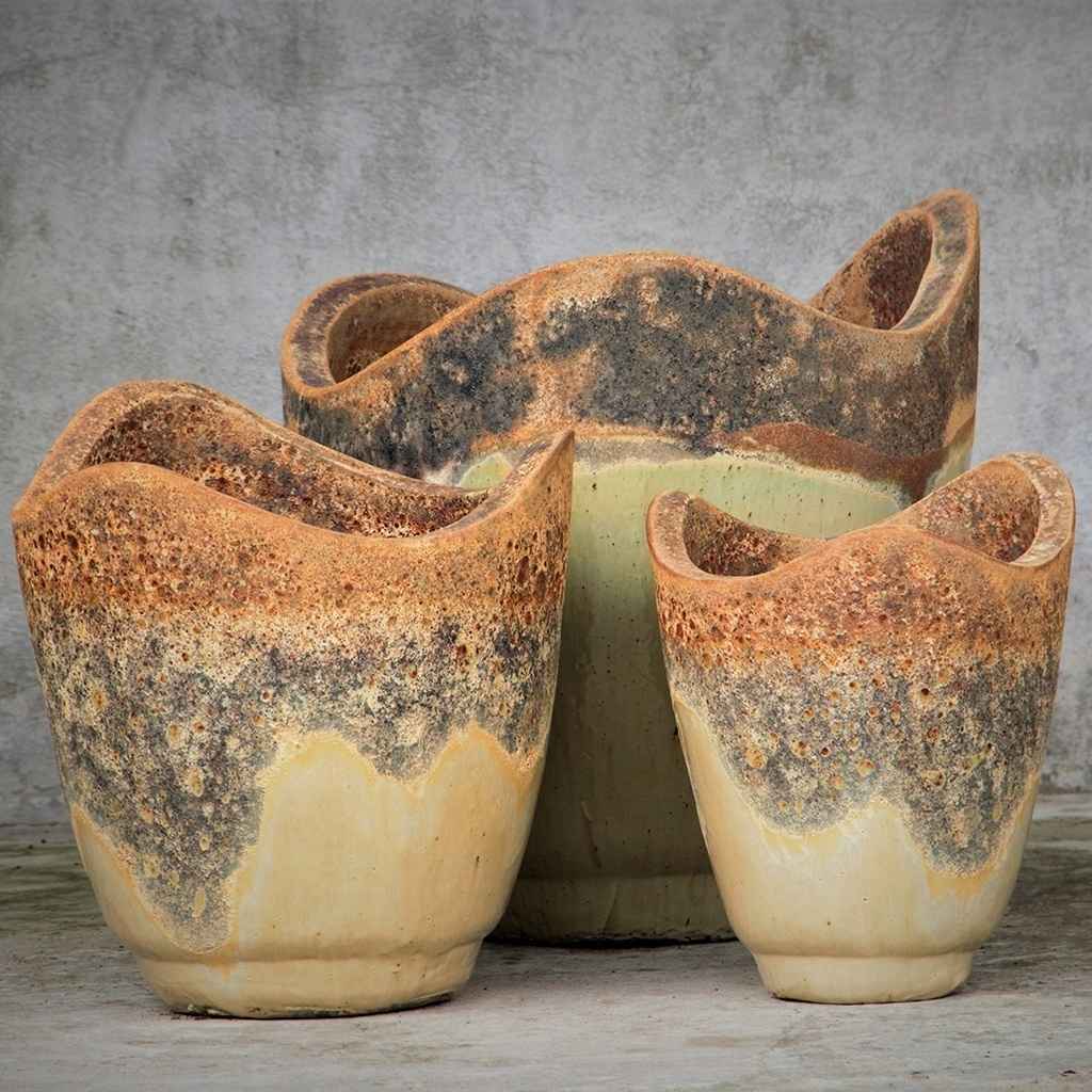Wave-top ceramic planter in beige with a rustic, textured rim