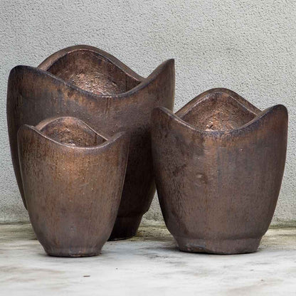 Wave-top ceramic planter in metallic brown with a textured, wavy rim and a smooth, matte finish