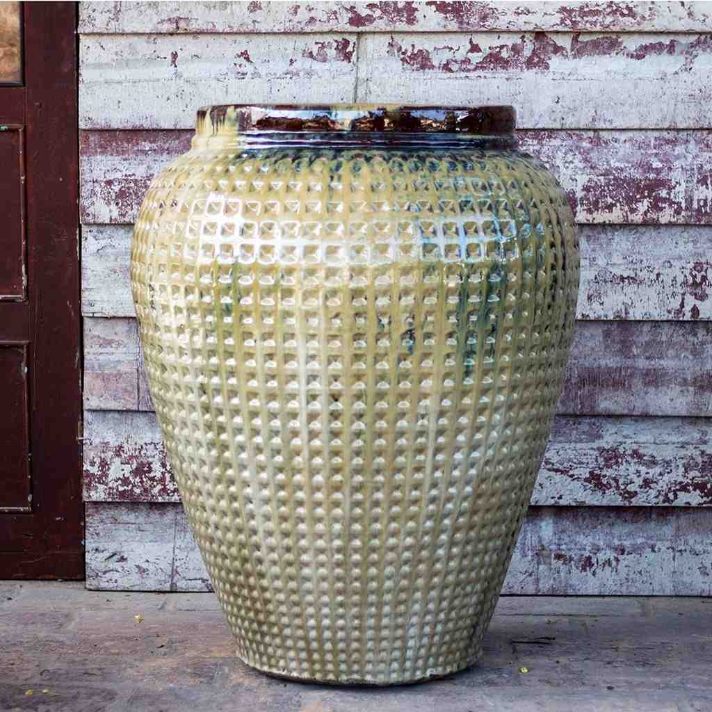 Quilted jar planter in soft yellow with dark rim accents, featuring a textured, quilted surface for added visual interest