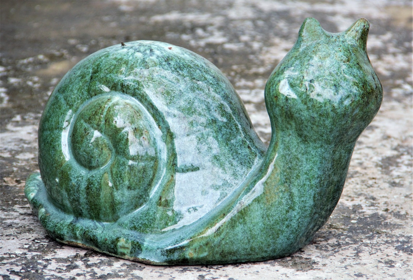 Glossy green ceramic snails for garden