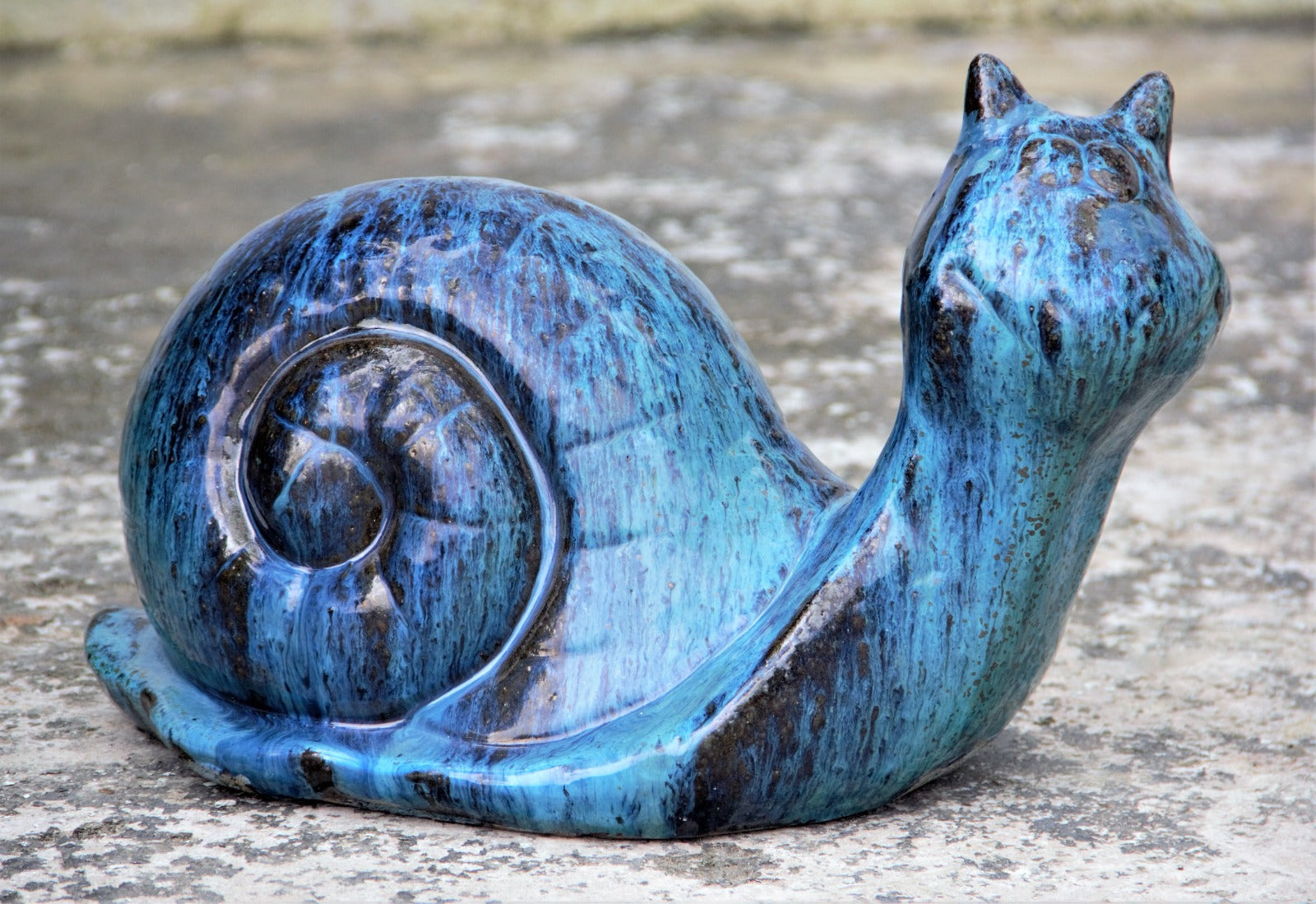 Glossy blue ceramic snails for garden