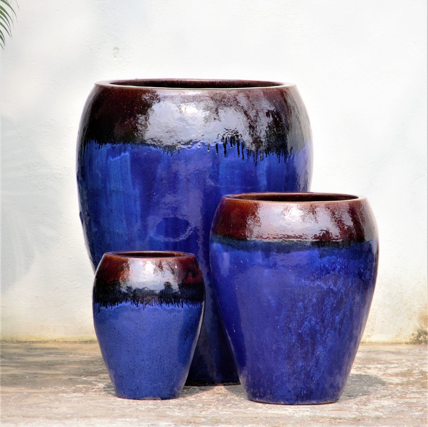 Blue Egg-Shaped Planter Pot with Brown Rim