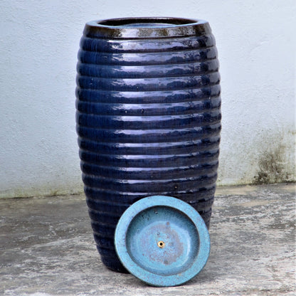 Glossy dark blue ribbed fountain jar