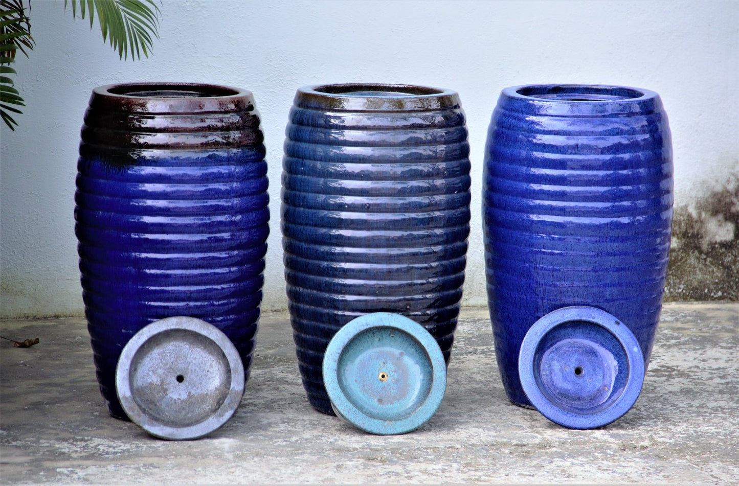 Glossy blue black, dark blue and blue ribbed fountain jar