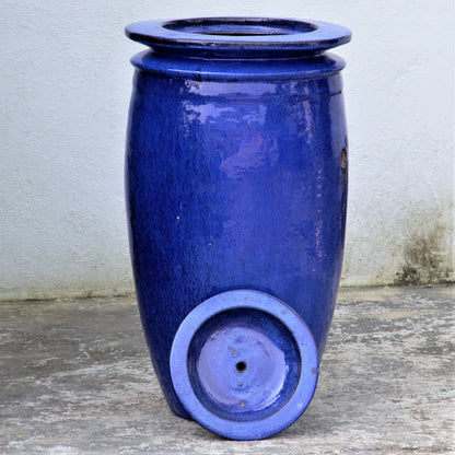 Glossy blue water jar fooutain