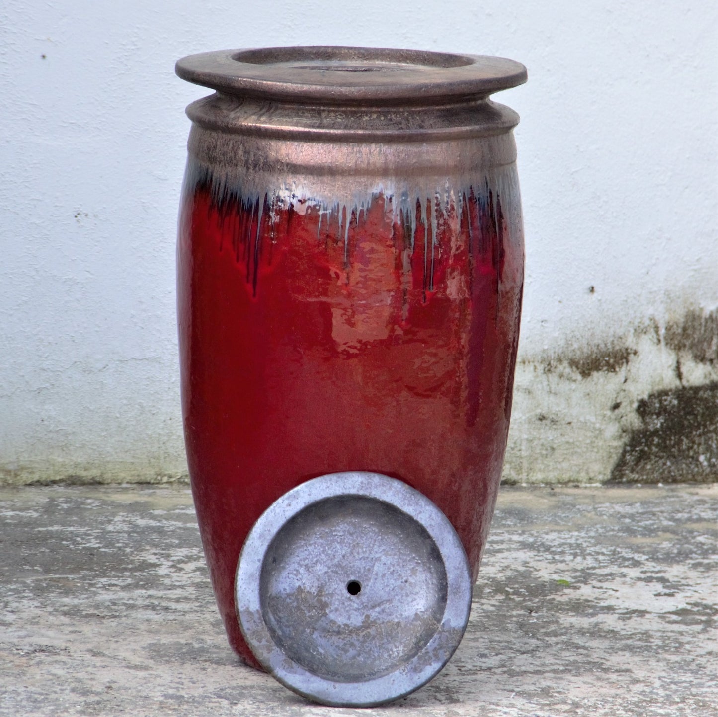 Glossy red water jar fountain
