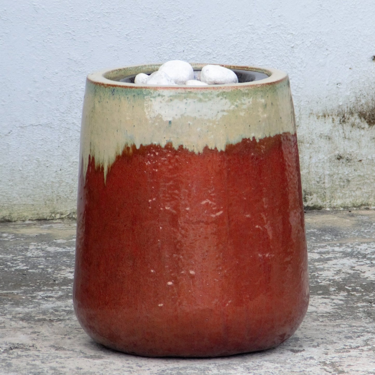 Cream/red textured fountain jar with white stones